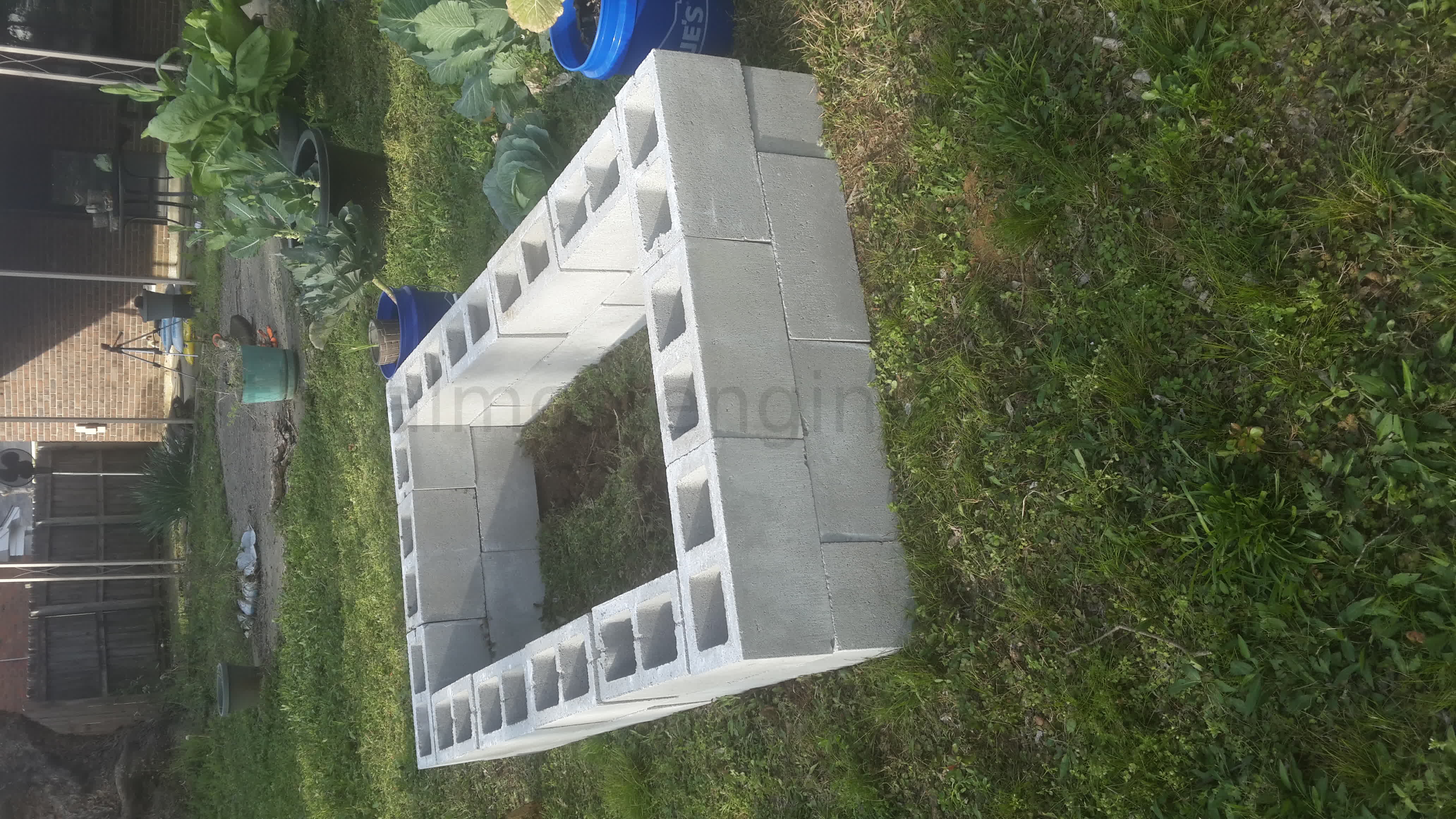 Showing blocks placed on the ground to make a raised bed